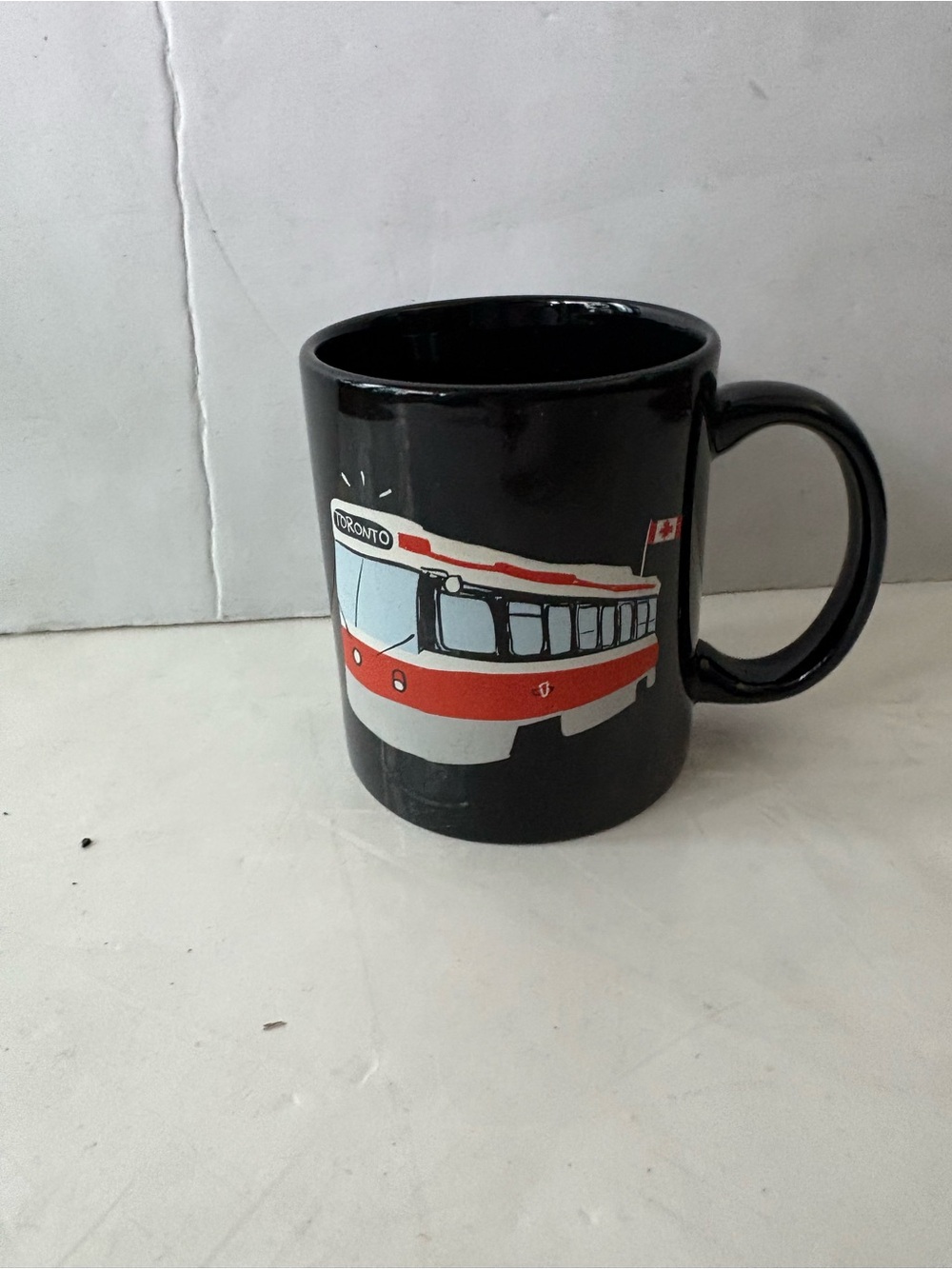 Black TTC Toronto Streetcar Ceramic Mug with Red and White Graphic